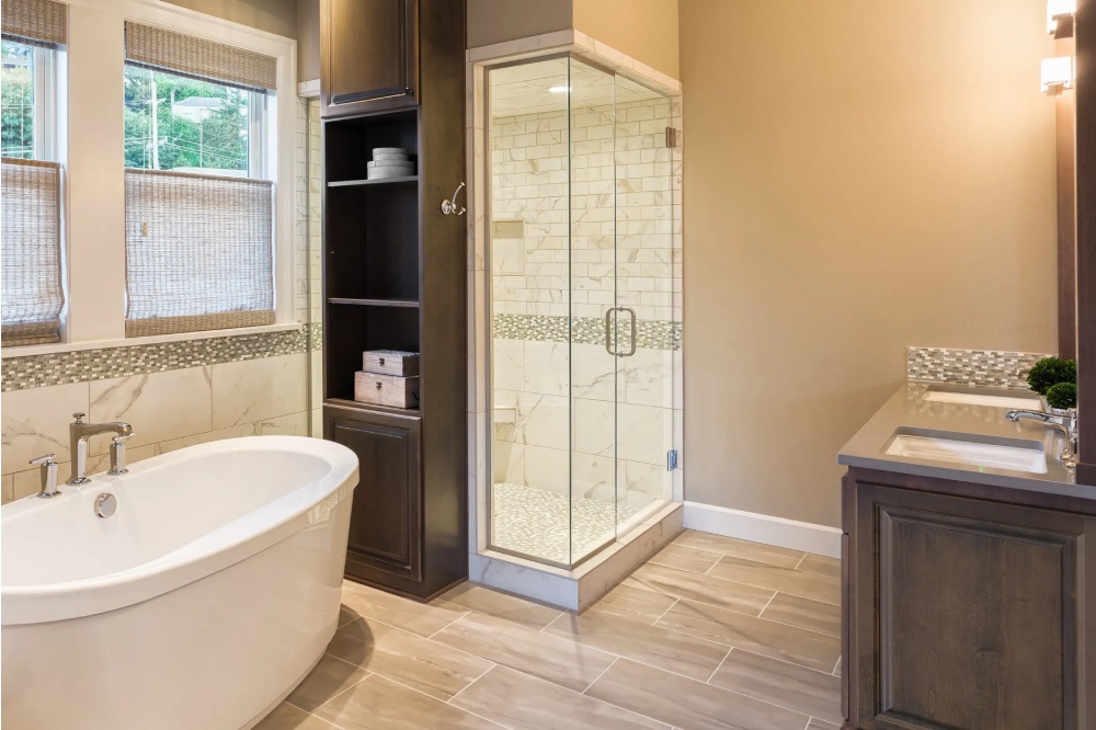 New Luxury NH Bathroom remodel with new soaking tub and glass shower enclosure by Kitchen Traditions
