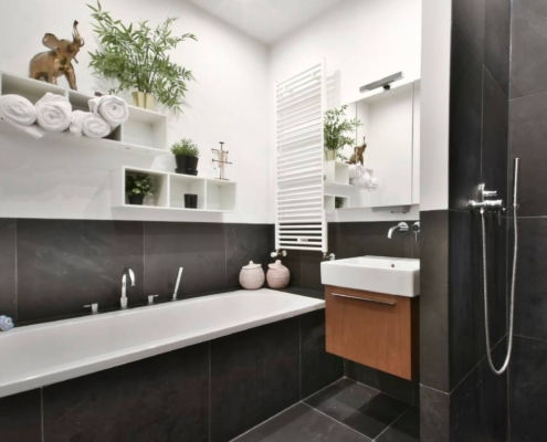 Recently renovated black and white bathroom with modern fixtures in a Merrimack NH home done by Shapiro Bathrooms & More.