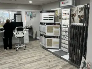 Designer at Shapiro Bathroom & More showroom in New Hampshire helps homeowners get started budgeting for a home renovation.