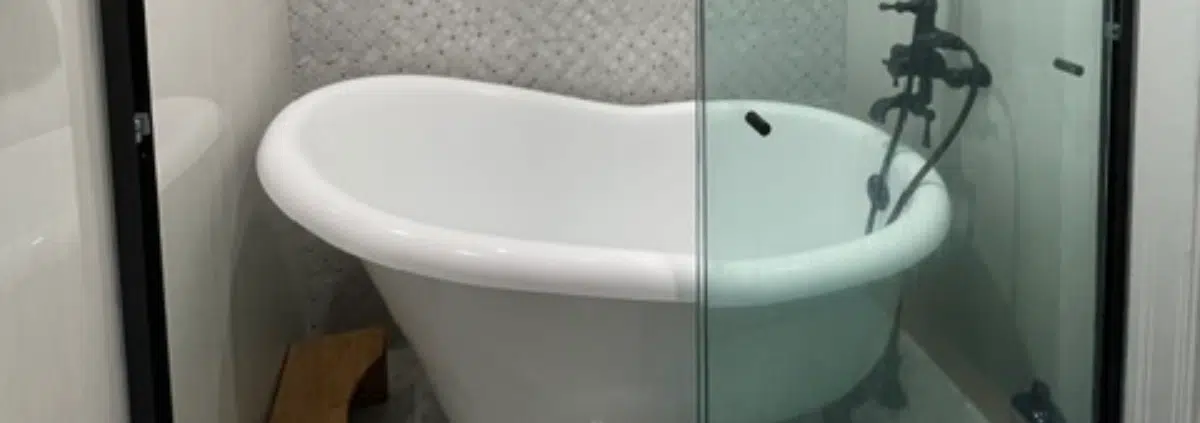 Tub-in-shower wetroom, also known as a shub. Features a freestanding bathtub inside of an open shower.